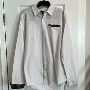 Men’s Quiet Life white button down with floral print inside.